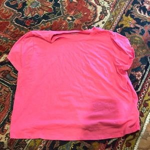 Hot pink sort of cropped t-shirt.